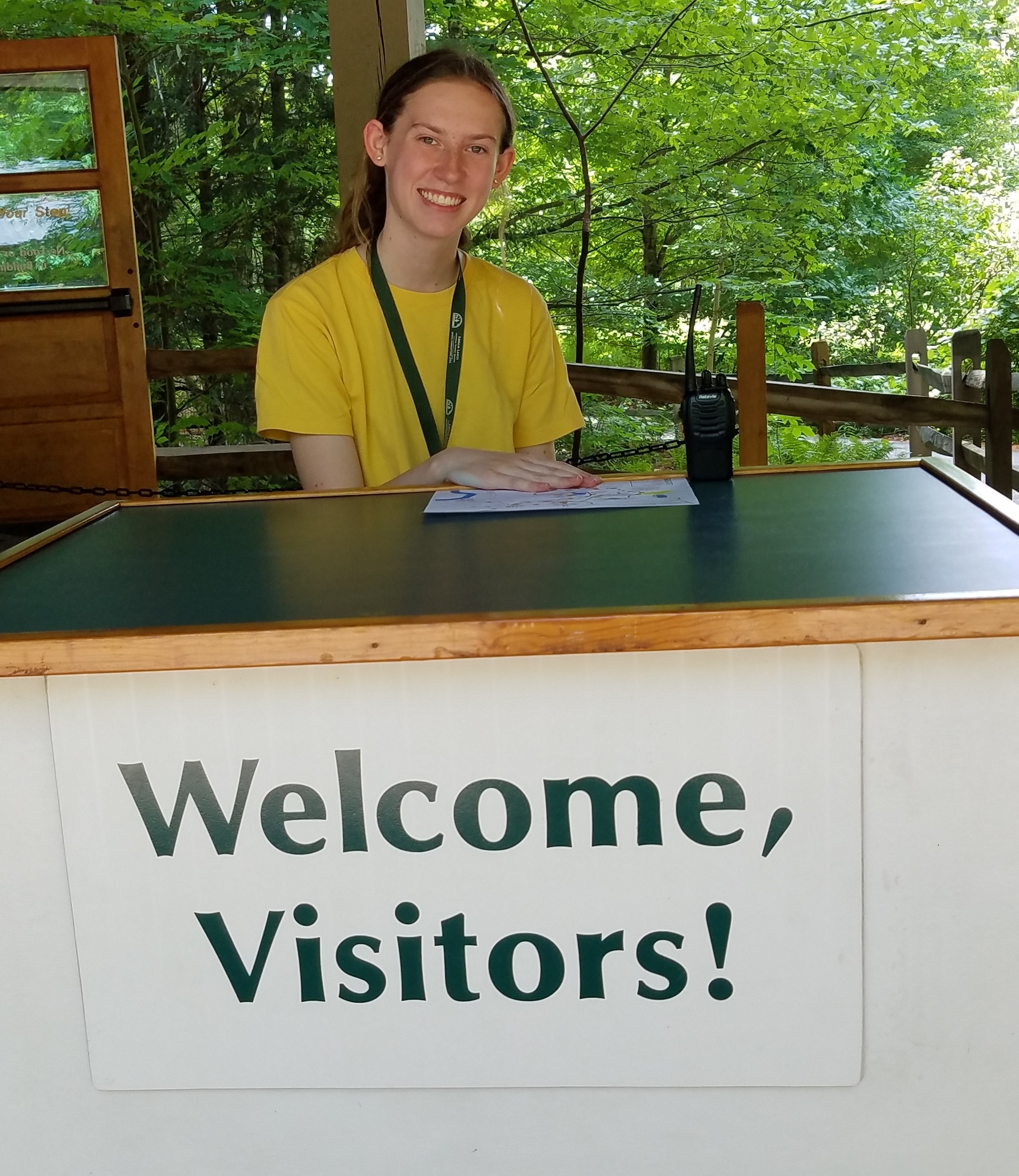 Abbi Gilbert greeting visitors at Trailhead.